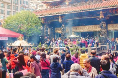 Worshipper inside Longshan Temple in Taipei